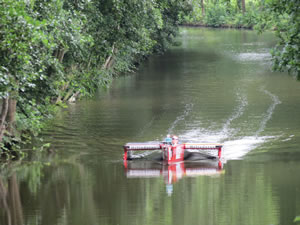 A solar boat in the narrow canal