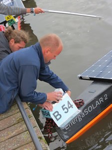 Dennis attaching a transponder to a boat